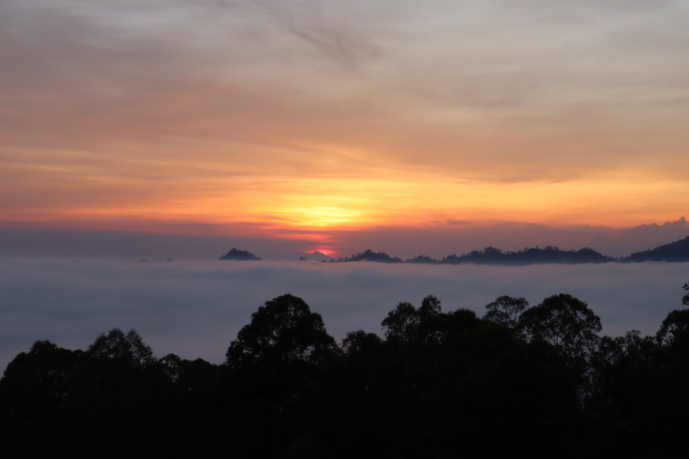 Sunrise over a misty mountain range